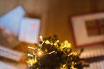 Christmas gifts around a tiny Christmas tree 