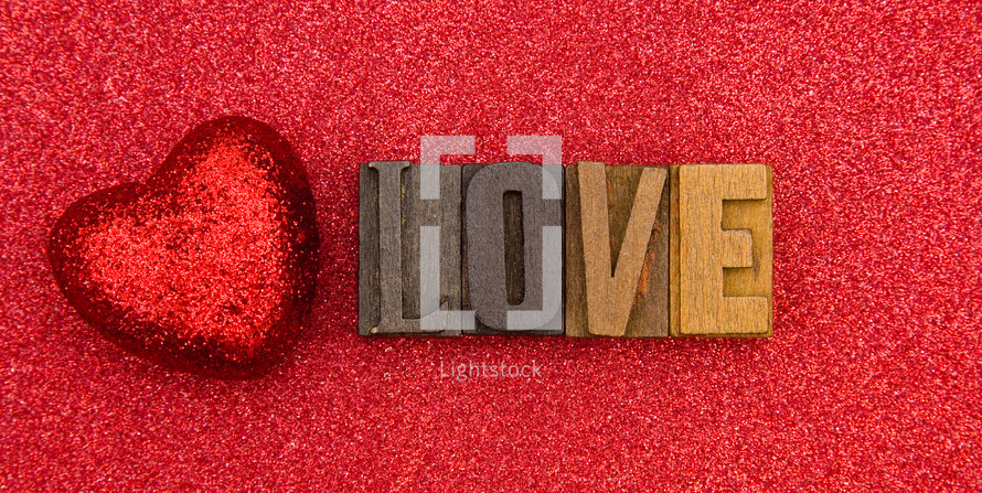 red heart on red and word love 