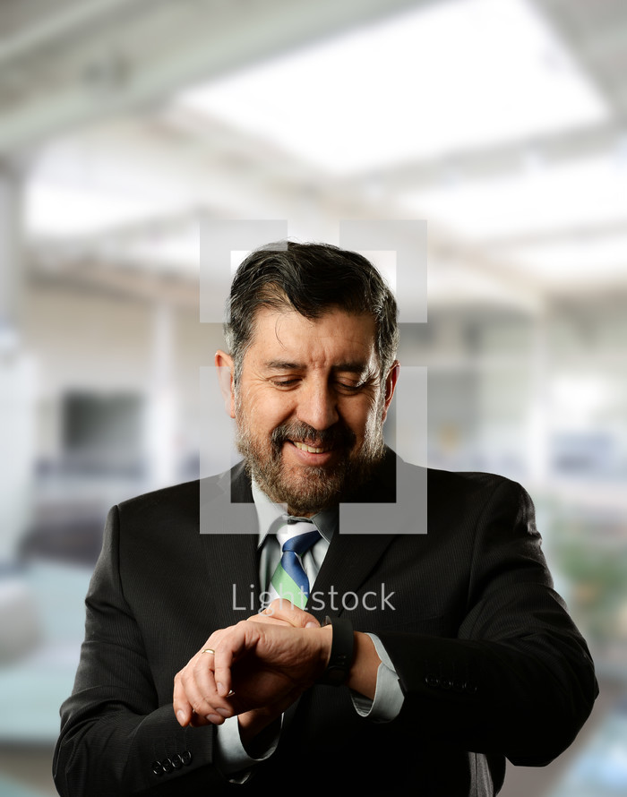 businessman looking at his watch 