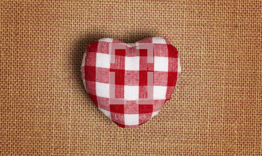 Red and White Plaid Love Heart on a Burlap Background