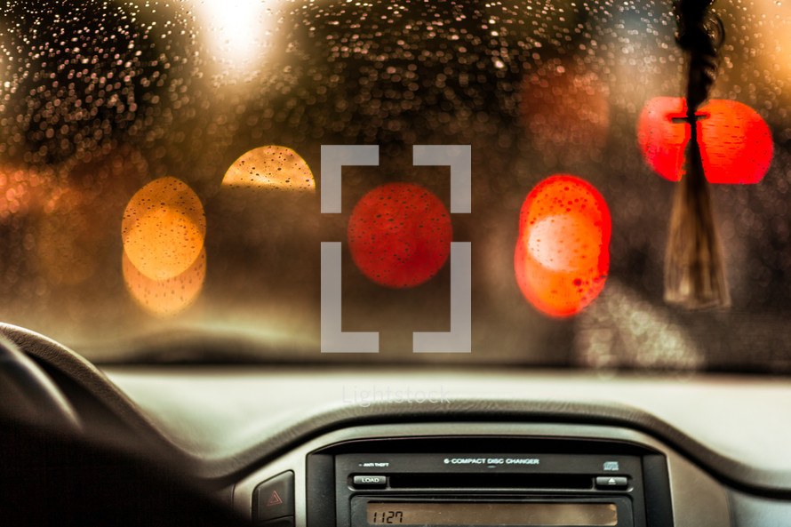 rain and bokeh lights on a car windshield 