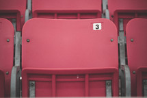 Red stadium seats.