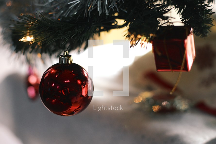 red Christmas ornament on a Christmas tree 