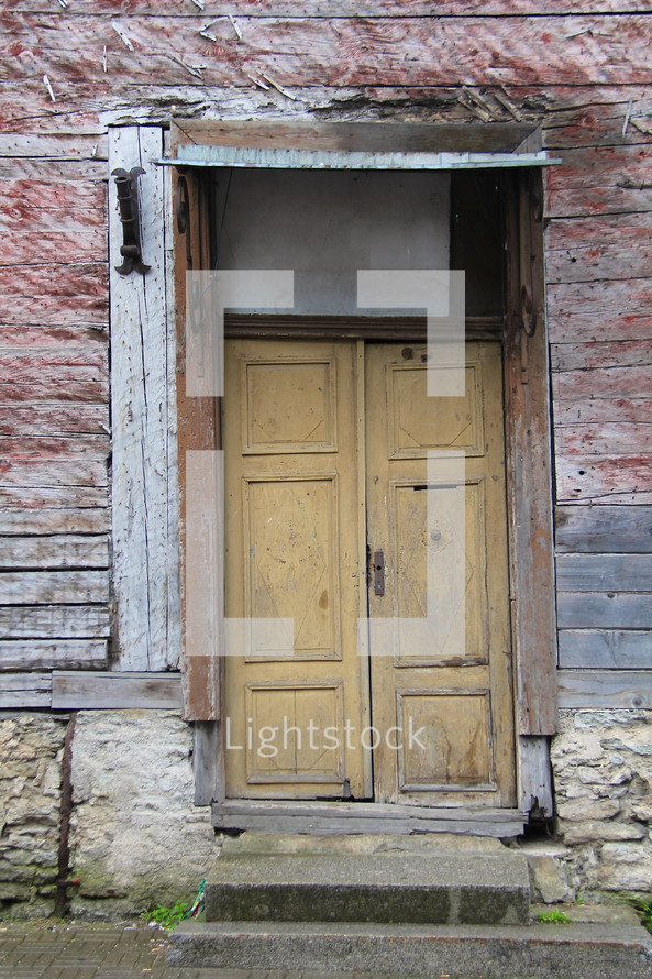 Door on an old deserted building 