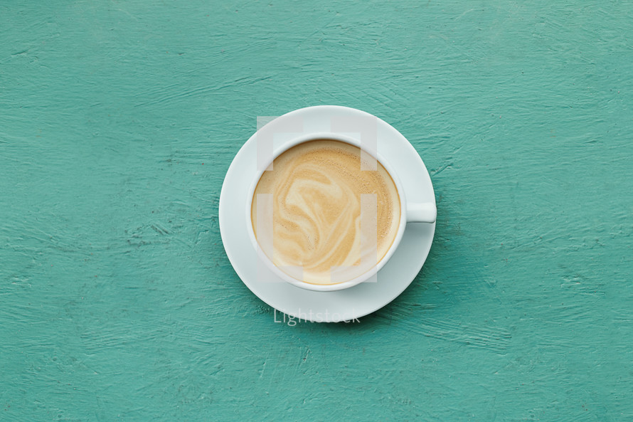 latte on a teal background 