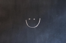 smiley face on a chalkboard 