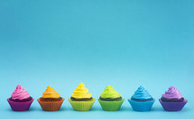 brightly colored rainbow cupcakes 