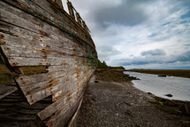Hull of a shipwreck at Dulas Bay at low tide