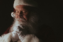 Santa Claus with praying hands 