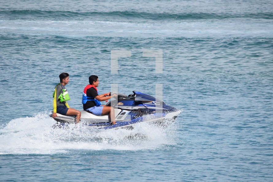 Young men on a jet ski 
