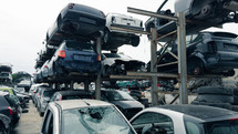 stacked scrap cars. recovery of car components