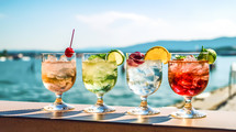 Cocktails in glass glasses near a beach in summer. AI Generate