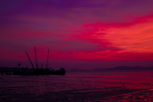 purple and red sky over the ocean 