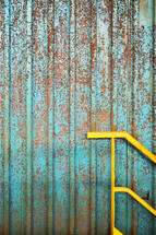Pattern of Rusty Metal Texture Background and Yellow Railing