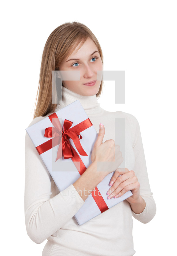 Woman holding a wrapped gift box.