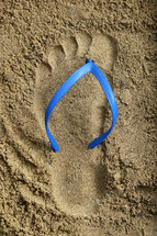Abstract Footprint Blue Rubber Beach Flip Flops on Sand