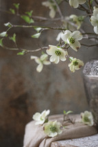 Small, white flowers in silver vase