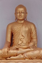 Golden Statue of Buddha seated in Lotus Position