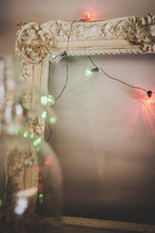 vintage frame with lights leaning on wall