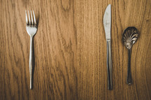 silverware on a wood background 