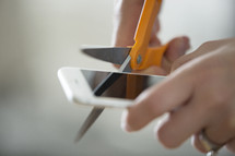 cutting up a smart phone.