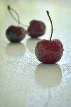 Closeup Cherry Fruits on Wooden Table and drops
