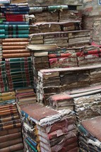 worn books in a stack 