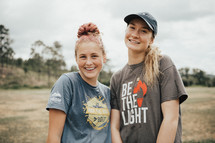 smiling young women on a mission trip 