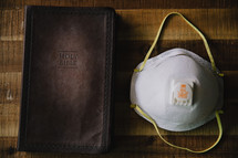 mask and Bible 