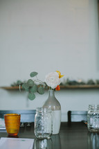 flowers in vases on a table for a wedding reception 