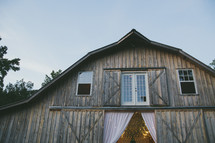 barn decorated for a wedding reception 