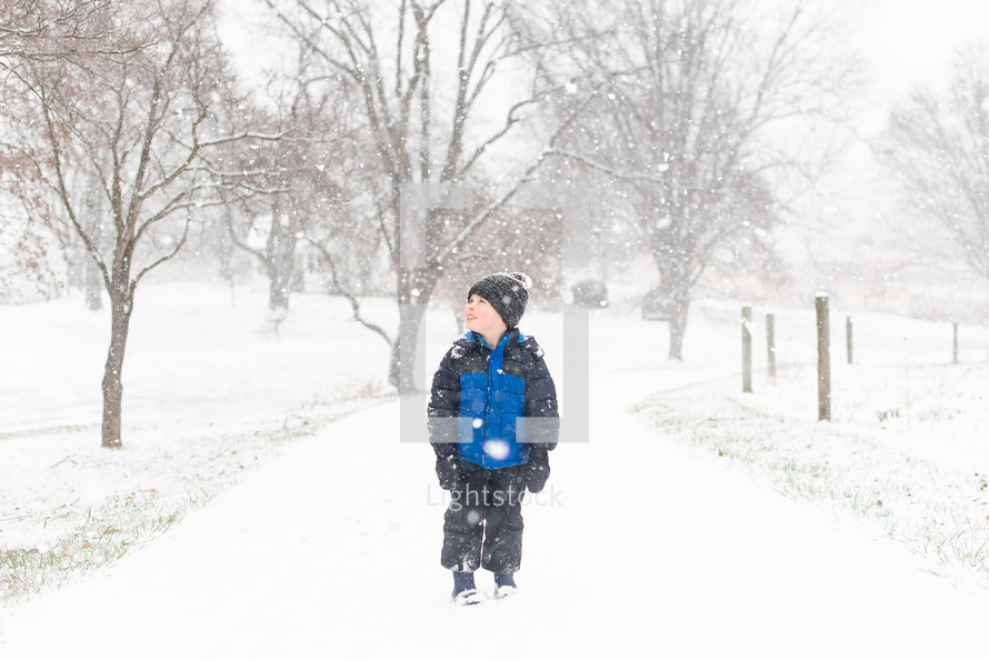 Small child playing in the snow