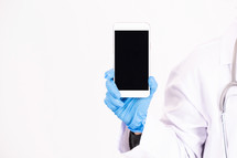 a doctor holding a blank cellphone screen. 