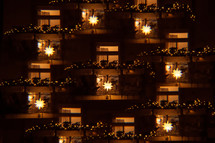 Christmas lights in a window at night 