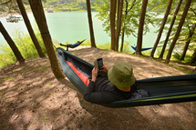 relaxing in a hammock in a forest 