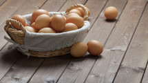  brown eggs in a basket 