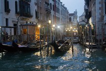 docked gondolas in Venice at night 