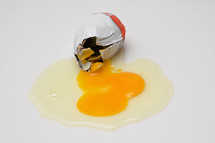 Abstract Cracked Egg With Yolk from A Chocolate Surprise Egg