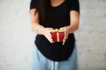a woman giving a gift 