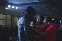 praying over others during a worship service 