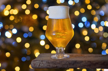 Beer in a glass with bokeh lights