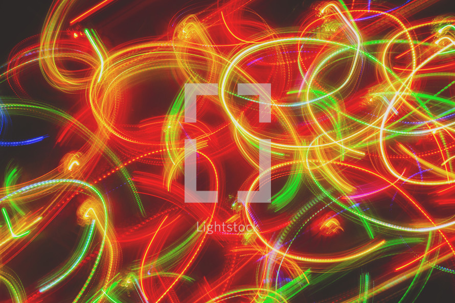 a long exposure of coloured lights while twirling the camera