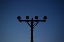 silhouette of a stadium light 
