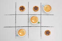 Game Of Tic-Tac-Toe from Cups of Espresso Coffee and Cookies