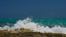 waves crashing onto a rocky shore 