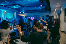 hands raised during a worship service 
