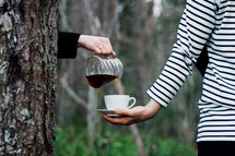 pouring coffee outdoors 