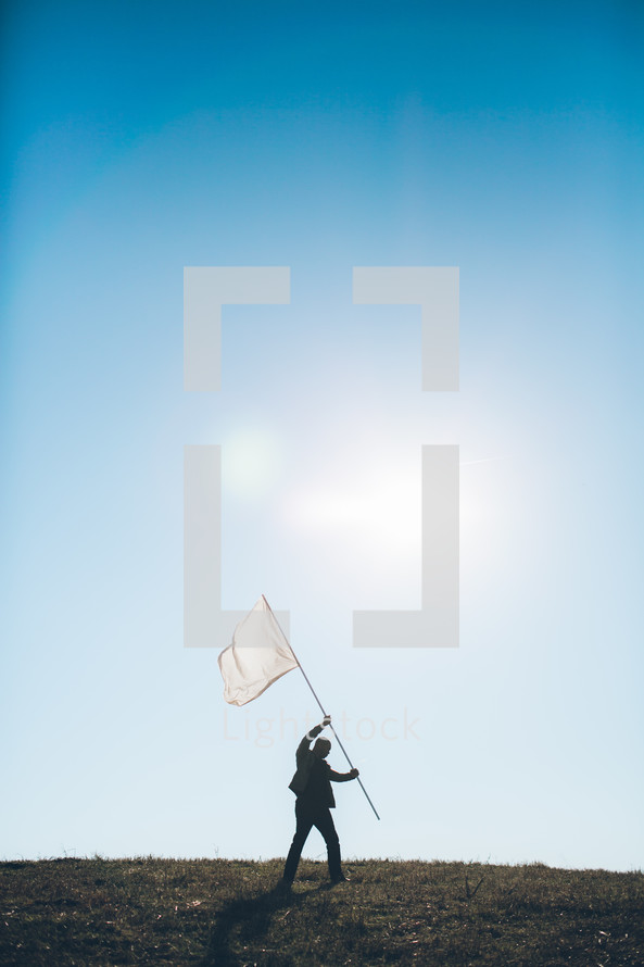 business man holding a white flag - surrendering 