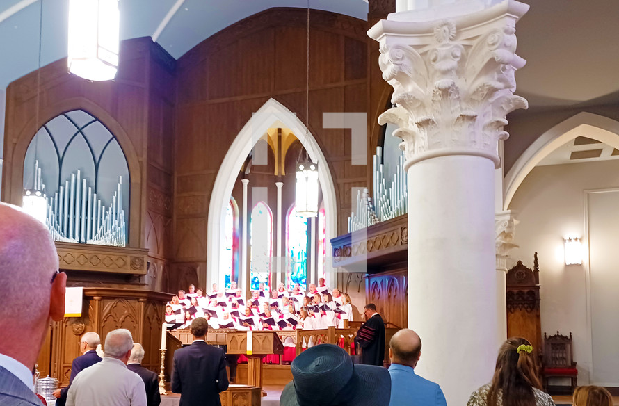 Church choir in robes singing in service