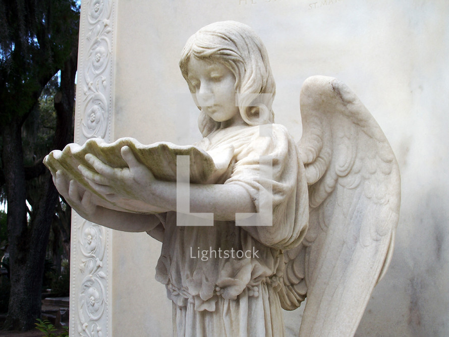 angel statue with bird bath 
